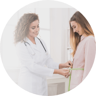 woman measuring her waist