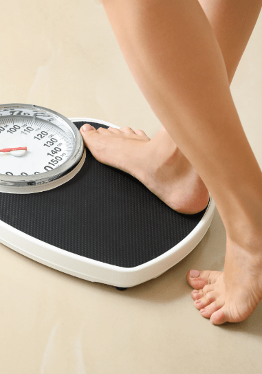 girl weighing herself