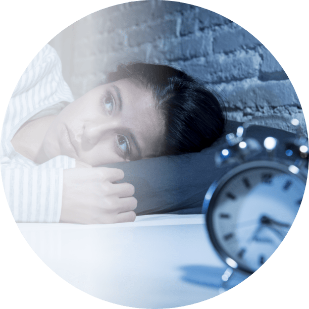 girl lying next to an alarm clock