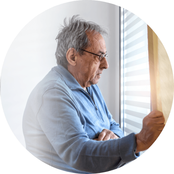 man looking out the window