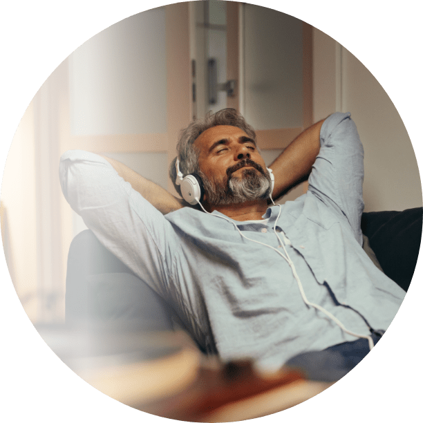 man relaxing and listening to music