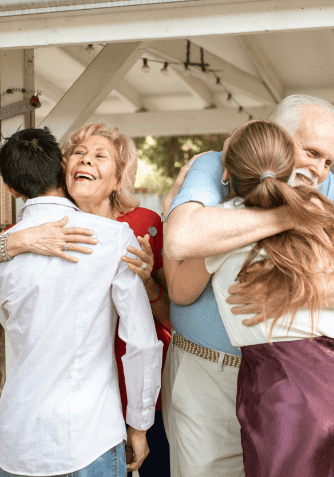 grandparents and grandchildren hugging