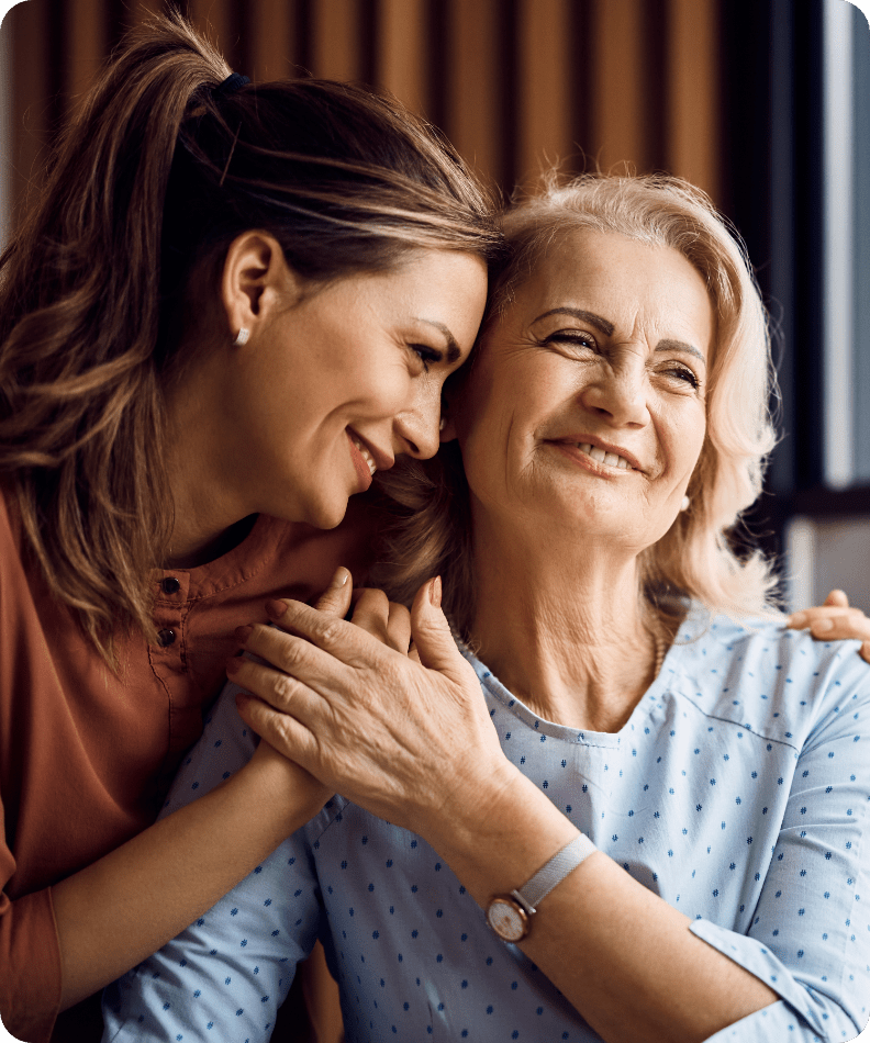 two ladies hugging each other