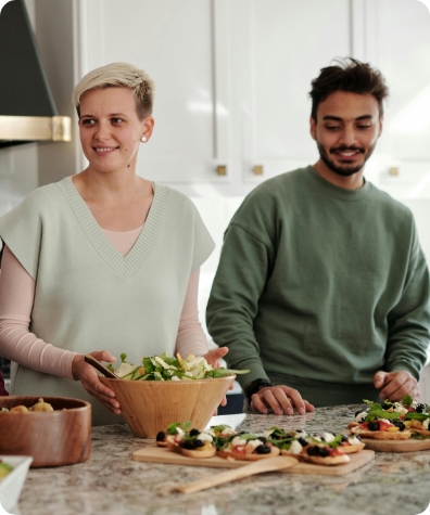Couple preparing salad